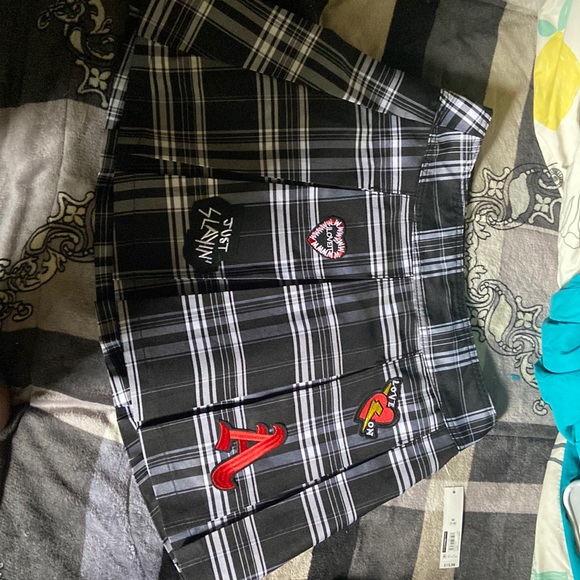 No Boundaries Dresses & Skirts - It’s a black and white skirt with red,black,white, and gold patches